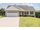 Charming single-story home with gray siding, white trim, and a spacious two-car garage at 118 Cypress Acres Ln, Statesville, NC 28625