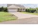Charming home featuring a long drive way, a two-car garage, and mature landscaping at 118 Cypress Acres Ln, Statesville, NC 28625