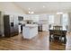 Modern kitchen with white cabinetry, granite countertops, stainless steel appliances, and a dining area at 118 Cypress Acres Ln, Statesville, NC 28625