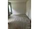 Bright bedroom featuring neutral walls, carpet flooring, and a window with natural light at 1411 Cottage Green Dr # 218, Monroe, NC 28112