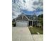 Beautiful two-story home with a two-car garage and well-maintained landscaping at 1411 Cottage Green Dr # 218, Monroe, NC 28112