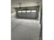 Spacious garage with concrete floors and an automatic garage door at 1411 Cottage Green Dr # 218, Monroe, NC 28112