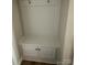 A white cubby area with a bench and storage cabinets in a mudroom at 1411 Cottage Green Dr # 218, Monroe, NC 28112