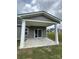 Covered patio with concrete flooring perfect for outdoor entertaining and enjoying backyard views at 1411 Cottage Green Dr # 218, Monroe, NC 28112