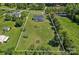 Aerial view of the home and property with approximate lot lines displayed at 142 Family Ln, Mount Holly, NC 28120