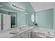 Bathroom with tub, linen closet and a large octagonal window at 142 Family Ln, Mount Holly, NC 28120