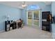 Bedroom with large window and blue painted walls at 142 Family Ln, Mount Holly, NC 28120