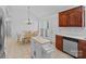 Cozy dining area with a table and chairs next to the kitchen, illuminated by a pendant light at 142 Family Ln, Mount Holly, NC 28120