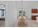 Bright dining area featuring a dining table with chairs and backyard views through a window at 142 Family Ln, Mount Holly, NC 28120