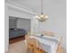 Cozy dining room featuring a six-chair dining set and modern overhead lighting at 142 Family Ln, Mount Holly, NC 28120