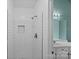 Updated bathroom with white subway tile shower and shampoo niche at 142 Family Ln, Mount Holly, NC 28120
