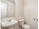 Powder room featuring a pedestal sink and standard toilet at 1432 Matthew Allen Cir, Kannapolis, NC 28081