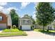 View of a charming two-story home with attached garage, nestled in a serene suburban neighborhood at 1432 Matthew Allen Cir, Kannapolis, NC 28081