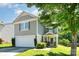 Attractive two-story home features attached garage, well-kept lawn, and charming front entrance with stone accents at 1432 Matthew Allen Cir, Kannapolis, NC 28081