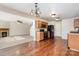 Open concept kitchen with black appliances, wooden cabinets and vinyl flooring leading to living area at 1432 Matthew Allen Cir, Kannapolis, NC 28081