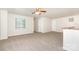 Bright living room boasting neutral carpet, a ceiling fan and multiple windows at 1432 Matthew Allen Cir, Kannapolis, NC 28081