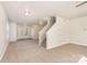 Inviting living area featuring neutral carpeting, staircase, and a seamless flow to the entry and other spaces at 1432 Matthew Allen Cir, Kannapolis, NC 28081