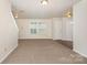 Bright, spacious living room with neutral carpet, ample natural light, and a welcoming atmosphere at 1432 Matthew Allen Cir, Kannapolis, NC 28081