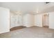Bright living room featuring neutral carpet, front door access and traditional lighting at 1432 Matthew Allen Cir, Kannapolis, NC 28081