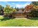 Beautiful backyard view with a spacious deck, lush green lawn, and mature trees offering shade at 1505 N Cansler St, Kings Mountain, NC 28086