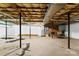 Unfinished basement with exposed ceiling, offering potential for customization at 1505 N Cansler St, Kings Mountain, NC 28086