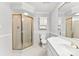 This bathroom features a glass shower and a white vanity sink at 1505 N Cansler St, Kings Mountain, NC 28086