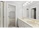 This bathroom features a double sink vanity, a large mirror, and neutral colors at 1505 N Cansler St, Kings Mountain, NC 28086