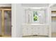This bathroom features a double sink vanity, a large mirror, and a shower at 1505 N Cansler St, Kings Mountain, NC 28086