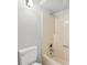 This bathroom features a cream-colored shower and a white toilet for a clean look at 1505 N Cansler St, Kings Mountain, NC 28086