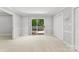 Bright bedroom with neutral carpet, and access to the backyard via sliding glass door at 1505 N Cansler St, Kings Mountain, NC 28086