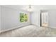 Bright bedroom with plush carpet, a ceiling fan, and a double closet at 1505 N Cansler St, Kings Mountain, NC 28086