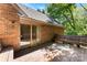 Wooden deck with sliding glass doors and built-in bench seating, perfect for enjoying the outdoors at 1505 N Cansler St, Kings Mountain, NC 28086