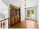 Dining room featuring wood floors, a built-in china cabinet, and a window at 1505 N Cansler St, Kings Mountain, NC 28086