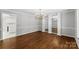 Elegant dining room with hardwood floors, a chandelier, and mirrored display shelves at 1505 N Cansler St, Kings Mountain, NC 28086