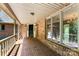Inviting brick porch with detailed railing and large windows at 1505 N Cansler St, Kings Mountain, NC 28086