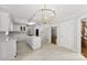 Spacious kitchen with island, granite countertops, stainless appliances and elegant chandelier at 1505 N Cansler St, Kings Mountain, NC 28086