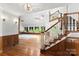 Bright living room with hardwood floors, grand staircase, and large windows at 1505 N Cansler St, Kings Mountain, NC 28086