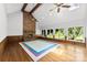 Spacious living room featuring a brick fireplace, wood floors, and large windows at 1505 N Cansler St, Kings Mountain, NC 28086