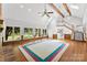 Open living room with wood beam ceilings, fireplace, and access to a kitchen at 1505 N Cansler St, Kings Mountain, NC 28086