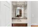 Convenient wet bar featuring modern fixtures and glass shelves, perfect for entertaining at 1505 N Cansler St, Kings Mountain, NC 28086