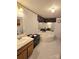 Bright bathroom with a large soaking tub, vanity, mirror, and neutral decor at 16711 Indian Mound Rd, Albemarle, NC 28001
