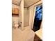 Compact bathroom with a walk-in shower, toilet, vanity, and built-in cabinet at 16711 Indian Mound Rd, Albemarle, NC 28001