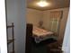 Cozy bedroom with comfortable bed, soft lighting, and a peaceful ambiance, creating a relaxing retreat at 16711 Indian Mound Rd, Albemarle, NC 28001