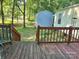 Wooden deck stairs leading down to a lush yard, perfect for outdoor enjoyment at 16711 Indian Mound Rd, Albemarle, NC 28001