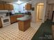 Spacious kitchen with light wooden cabinets, a kitchen island and modern appliances, providing ample space and functionality at 16711 Indian Mound Rd, Albemarle, NC 28001