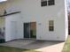 White townhouse exterior featuring a private back patio with sliding glass door access and additional door at 1814 Birch Heights Ct, Charlotte, NC 28213
