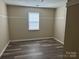 Comfortable bedroom with hardwood flooring and a bright window, perfect for relaxation at 1814 Birch Heights Ct, Charlotte, NC 28213