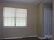 Bedroom with a window bringing in natural light and closet providing ample storage space at 1814 Birch Heights Ct, Charlotte, NC 28213