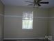 Bright bedroom featuring a ceiling fan and a well-lit window, offering a comfortable retreat at 1814 Birch Heights Ct, Charlotte, NC 28213