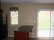 Kitchen with access to the outdoors, black appliances and dark countertops at 1814 Birch Heights Ct, Charlotte, NC 28213